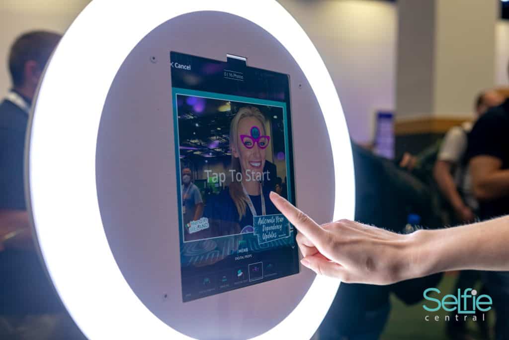 Interactive selfie booth touchscreen at Auckland event for fun photo experiences.