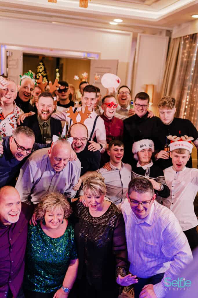 Group of friends and family enjoying fun at Photo Booth Auckland event.