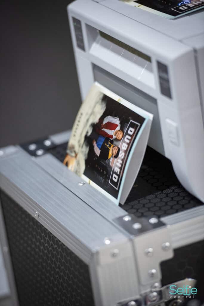 Photo booth printing a photo at Auckland event, perfect for parties and celebrations.