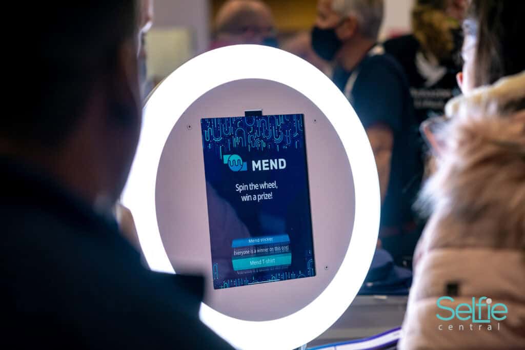Selfie Central photo booth with digital screen and ring light at an event in Auckland.